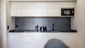 Fridge, microwave, stovetop, coffee/tea maker