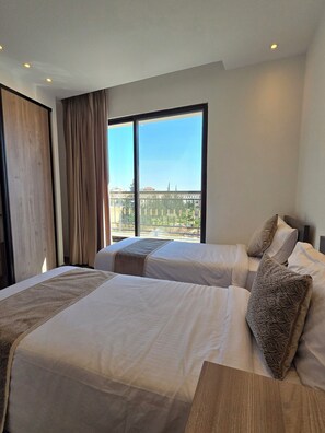 Family Apartment, 2 Bedrooms, Balcony, City View | Premium bedding, Select Comfort beds, in-room safe - ALSHAKREEN SUITES (Amman)