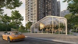 A modern building with a curved glass facade and the name "MASTERI West Heights" displayed prominently.