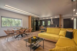 Villa, Mountain View | Living area | 55-inch Smart TV with satellite channels - Villa Lona (Platanias)