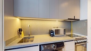 Fridge, microwave, stovetop, coffee/tea maker