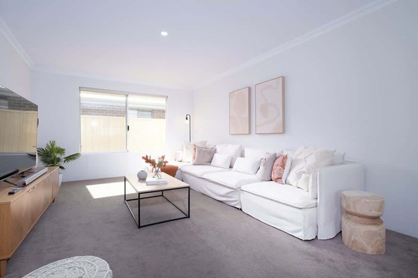 A second living area offers a quiet retreat for movie nights, family favourites, or simply stretching out after a day exploring the coast.