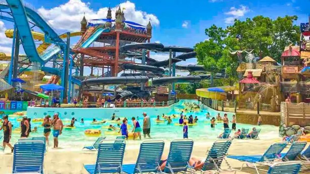 A water park with a large pool, water slides, and various water features. - 2 bedrooms, 3 beds, 2 bathrooms cozy house by the bay. (Bacliff)