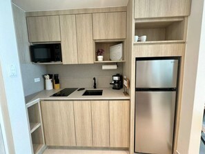 Fridge, microwave, stovetop, coffee/tea maker
