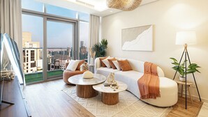 Un salon moderne avec une grande fenêtre, un canapé, deux tables basses et un lampadaire.