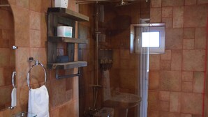 A bathroom with a glass shower enclosure, a sink, and a towel rack. - Gosh Dream House (Gosh)