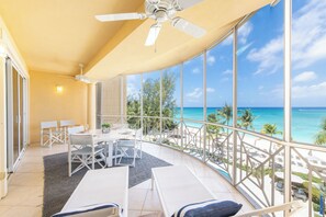 Outdoor dining - The Meridian Villa 24, Fourth floor, 3BR/3B, Oceanfront, fully equipped. (Seven Mile Beach)