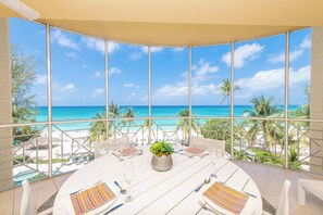 Outdoor dining - The Meridian Villa 24, Fourth floor, 3BR/3B, Oceanfront, fully equipped. (Seven Mile Beach)