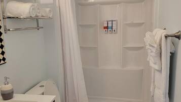Shower, hair dryer, towels, soap