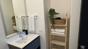 Hair dryer, towels, soap, toilet paper