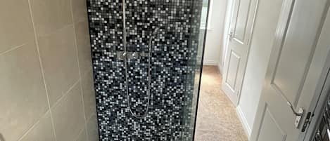 Shower, hair dryer, towels, soap