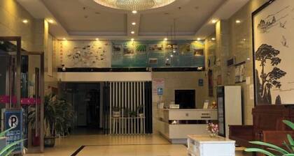 Q+ Nanxiong Xinhewan Business Hotel