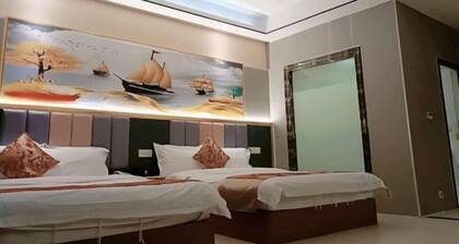 Q+ Nanxiong Xinhewan Business Hotel