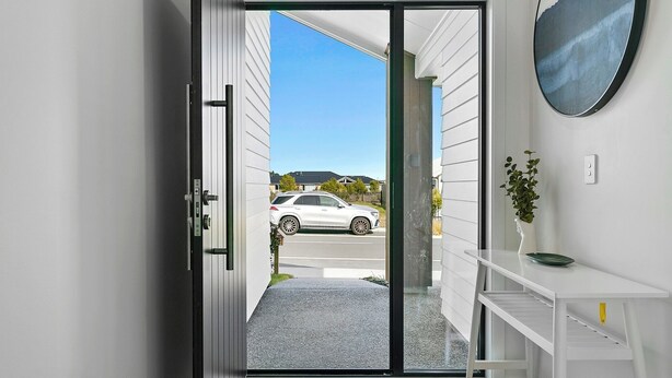 A modern interior with a sliding glass door leading to a parking area. - Brand New Cosy and Convenient Retreat in Taupo  (Taupo)