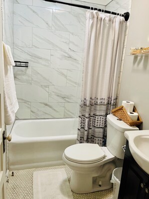 Hair dryer, towels, soap, toilet paper