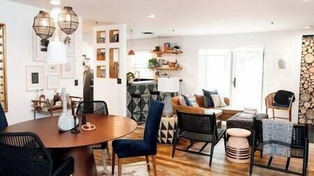 A modern living room with a round dining table, blue chairs, a sofa with patterned cushions, and a coffee table. - Park City Condo, Park City Condo In The Heart Of Park City (Park City)