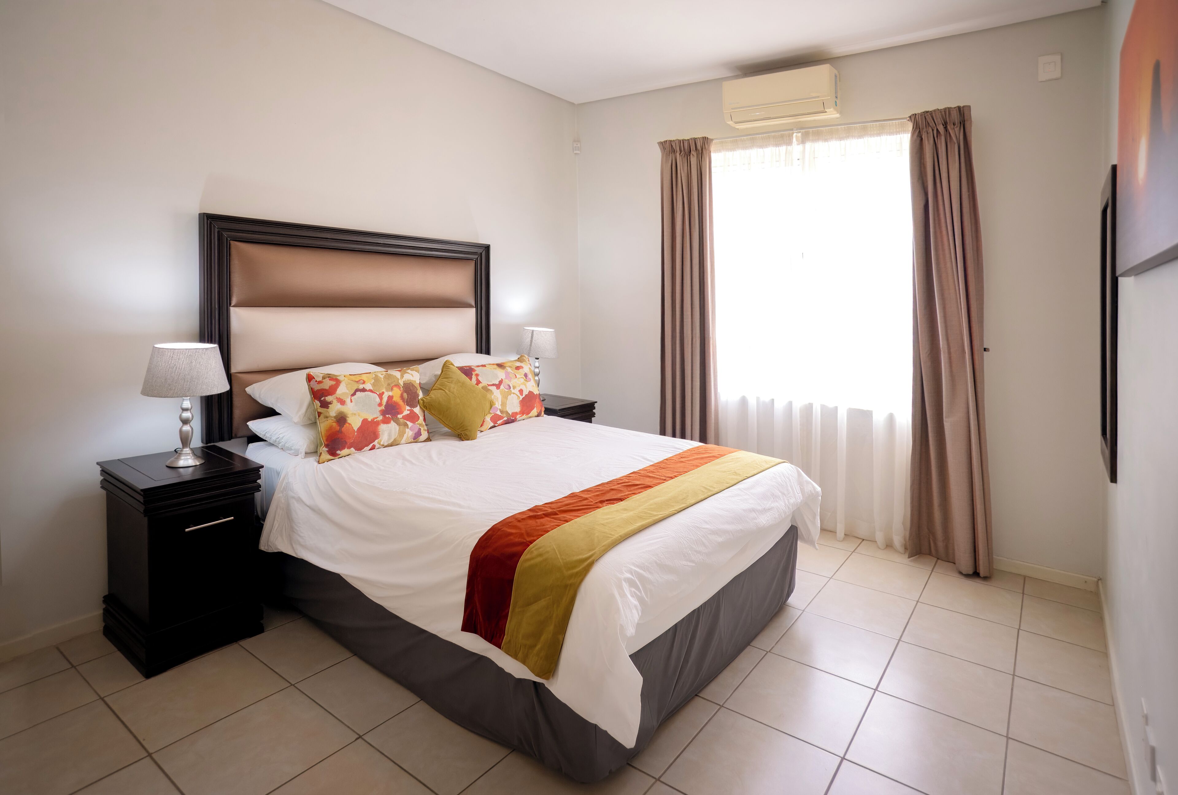 Premium bedding, desk, laptop workspace, iron/ironing board