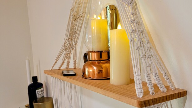 A wooden shelf with candles, a phone, and a bottle. - Private Forest Retreat • Spa Bath • Near the Coast • Central Midcoast Hub (Searsport)