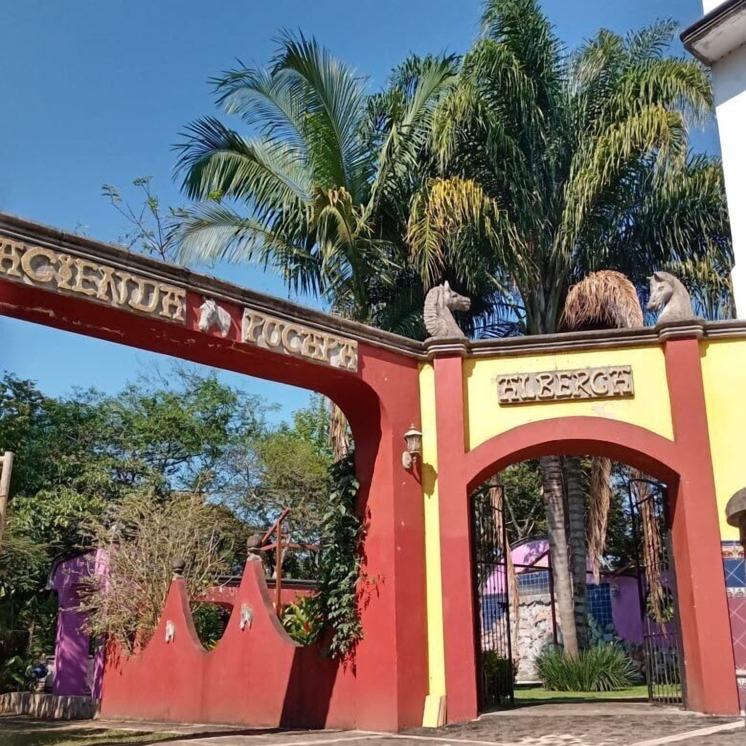 A red and yellow entrance gate with the text "PUEBLA" and "FIREBRI" on it.