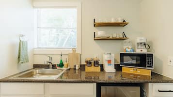 Microwave, coffee/tea maker, electric kettle, cookware/dishes/utensils