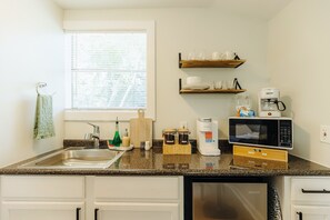 Microwave, coffee/tea maker, electric kettle, cookware/dishes/utensils