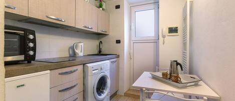 Fridge, stovetop, coffee/tea maker, cookware/dishes/utensils