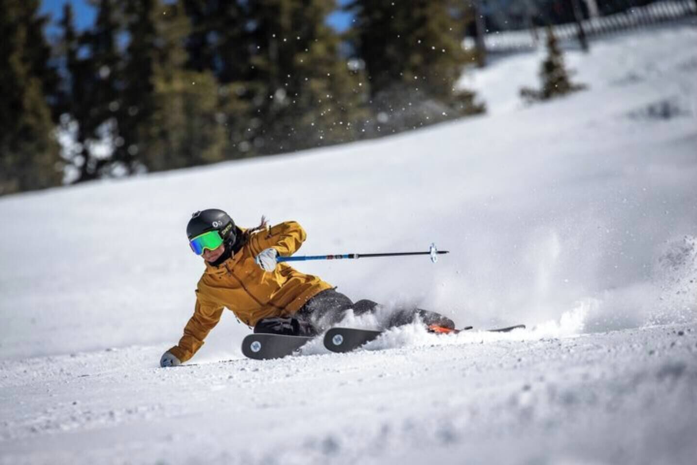 A person skiing down a snowy slope.