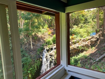 Romantic waterfall cabin in the rain forest