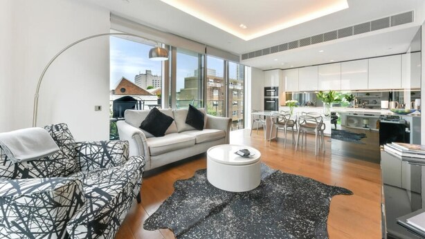 A modern apartment with a living room, dining area, and kitchen. - London Oasis Retreat With 2 Bedrooms - Fulham (London)