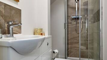 Shower, hair dryer, towels, soap