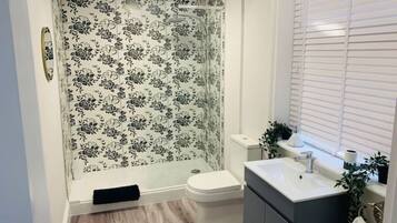 Shower, hair dryer, towels, soap