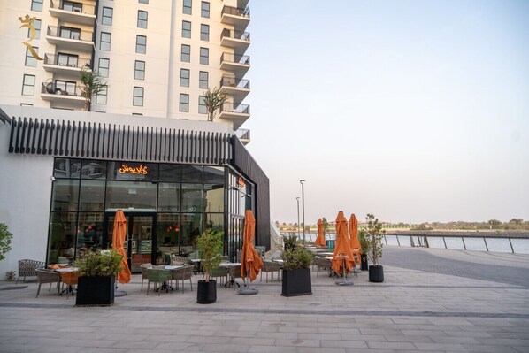 A modern building with a restaurant named 'Saba's' on the ground floor.