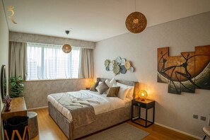 1 bedroom, desk, iron/ironing board, travel crib