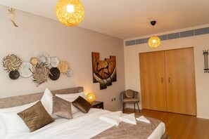 1 bedroom, desk, iron/ironing board, travel crib