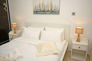 2 bedrooms, desk, iron/ironing board, travel crib