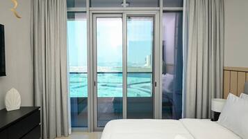 1 bedroom, desk, iron/ironing board, travel crib