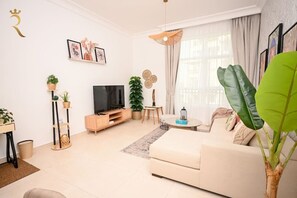 Sink into Comfort: Embrace Relaxation on the Plush Sofa in Our Living Room.