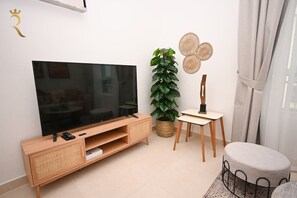Experience the joy of movie magic in our stylish and comfortable TV haven.