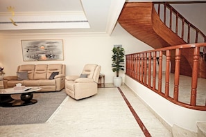 Savor the moments in our thoughtfully curated luxury living room retreat.