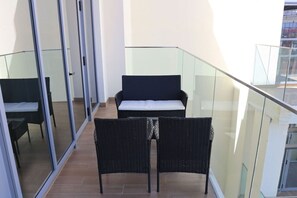 Relax and enjoy the outdoors in a beautifully designed space with stylish, comfortable seating. - Oasis Tranquil Retreats- 1BR (Abu Dhabi)