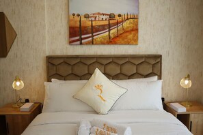 Unwind in a bedroom where comfort meets high-end design for a restful escape.