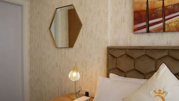 Experience a bedroom where classic design elements meet contemporary comforts for ultimate relaxation.