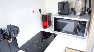 Experience the perfect blend of high-end design and practical appliances in this modern kitchen.