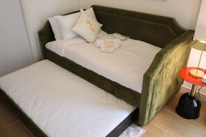 A peaceful night`s sleep awaits in this cozy bedroom with a stylish and functional trundle bed. - City Nest - 2BR apartment. (Abu Dhabi)