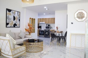 A living area that blends style and comfort seamlessly for your ultimate getaway. - City Nest - 2BR apartment. (Abu Dhabi)