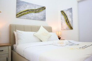 2 habitaciones, tabla de planchar con plancha, cuna de viaje y wifi