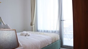 2 habitaciones, tabla de planchar con plancha, cuna de viaje y wifi 