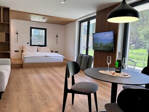 Deluxe Studio, Sauna, Mountain View | Living area | 55-inch Smart TV with digital channels, heated floors - Vila Nina Bohinj (Bohinj)