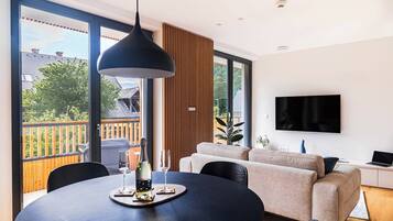 Family Apartment, 2 Bedrooms, Balcony, Mountain View | Living area | 55-inch Smart TV with digital channels, Netflix, heated floors