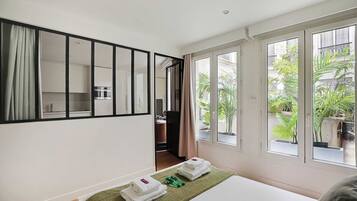 1 bedroom, desk, iron/ironing board, travel crib